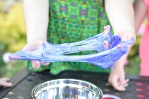 kid holding slime