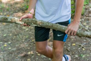 kid holding stick