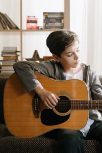 boy playing guitar