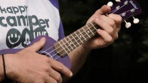 hands playing ukelele