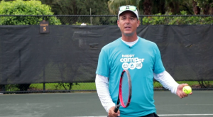 instructor teaching tennis