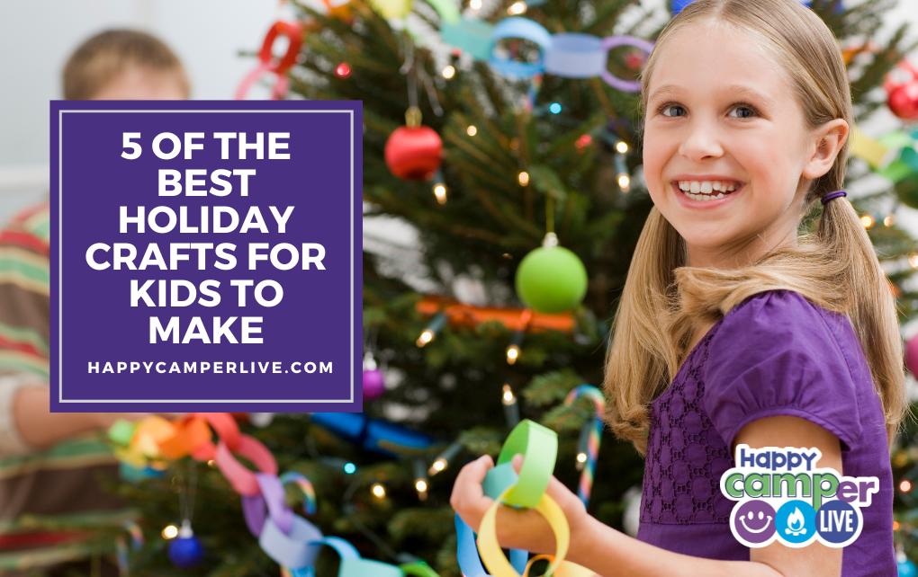 a child holds a paper chain