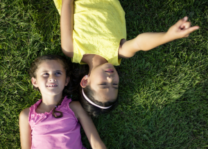 kids watch and point at clouds