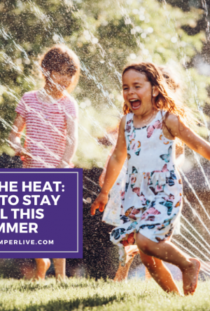 a child runs through the sprinklers