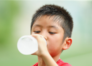 a child drinks a water bottle