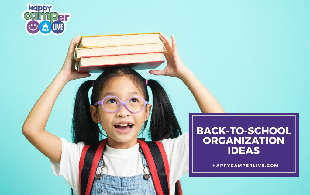 a child holds books on her head