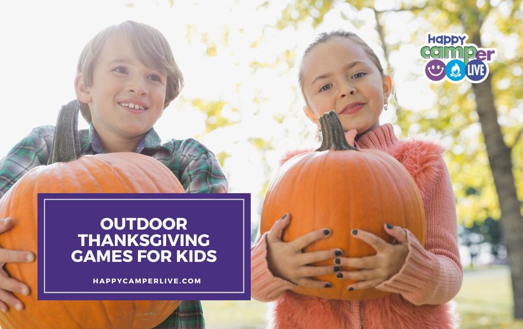 A child holds a pumpkin
