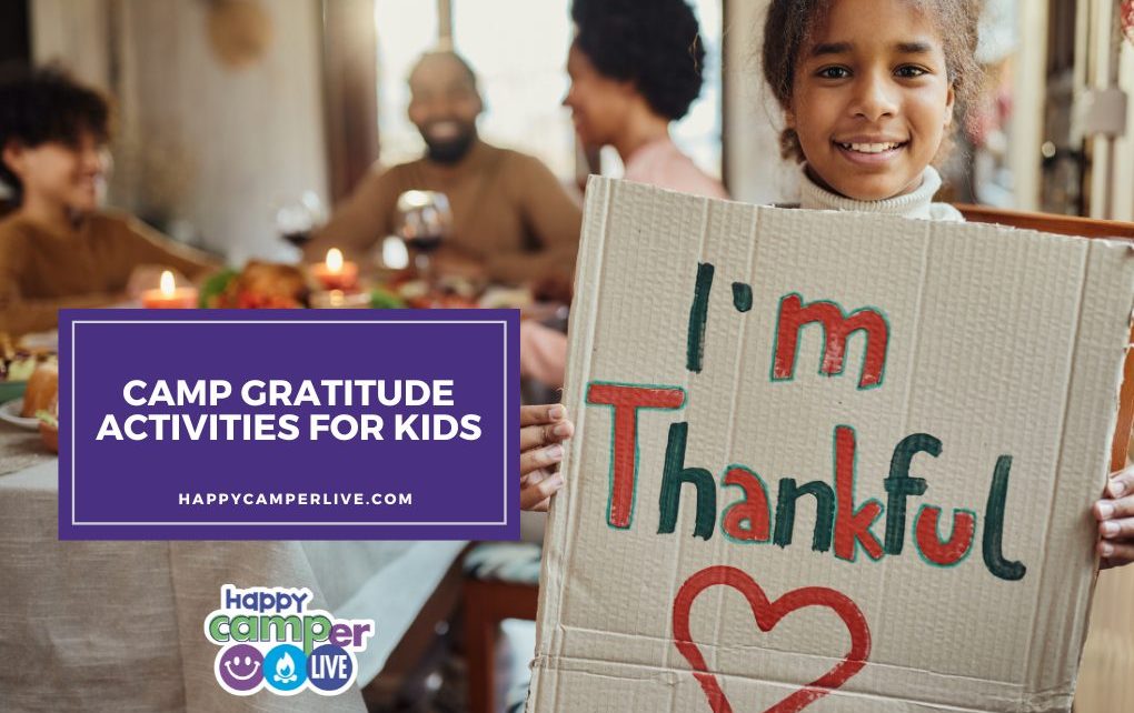 a child holds a sign that reads I'm thankful