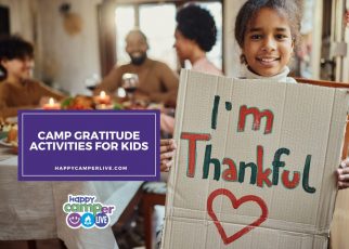 a child holds a sign that reads I'm thankful